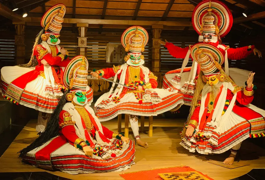 This image depicts a performance of Kathakali, a classical dance-drama from Kerala, India. 