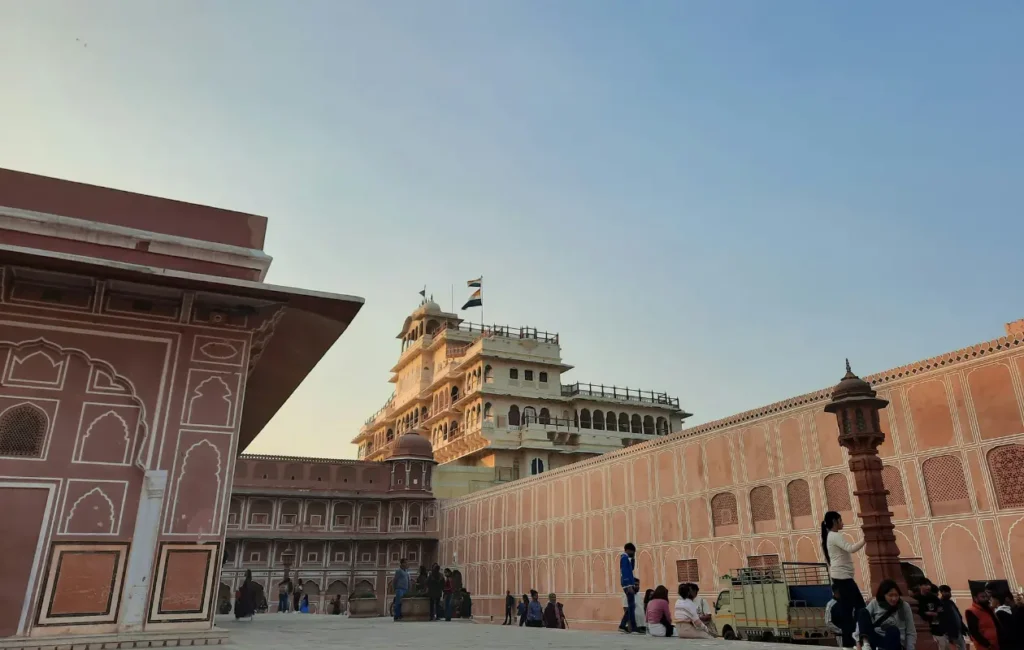 This image shows the City Palace in Jaipur, Rajasthan, specifically featuring the Chandra Mahal building within the Pritam Niwas Chowk courtyard. 